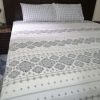 printed luxurious white bed sheet